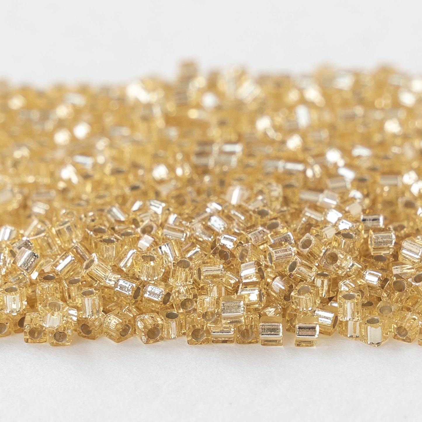 1.8mm Miyuki Cube Beads  - Silver Lined Gold - 20 grams