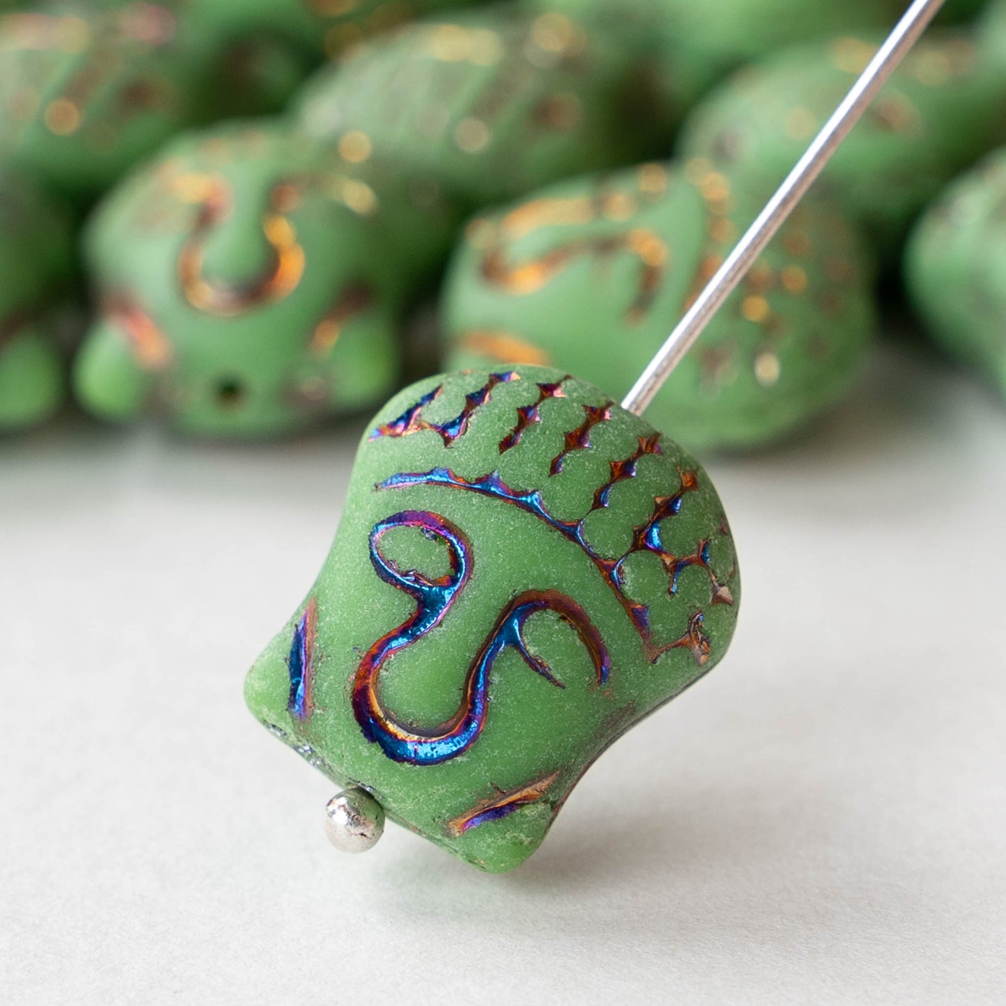 Glass Buddha Head Beads - Matte Green with Iris Wash - 4 beads