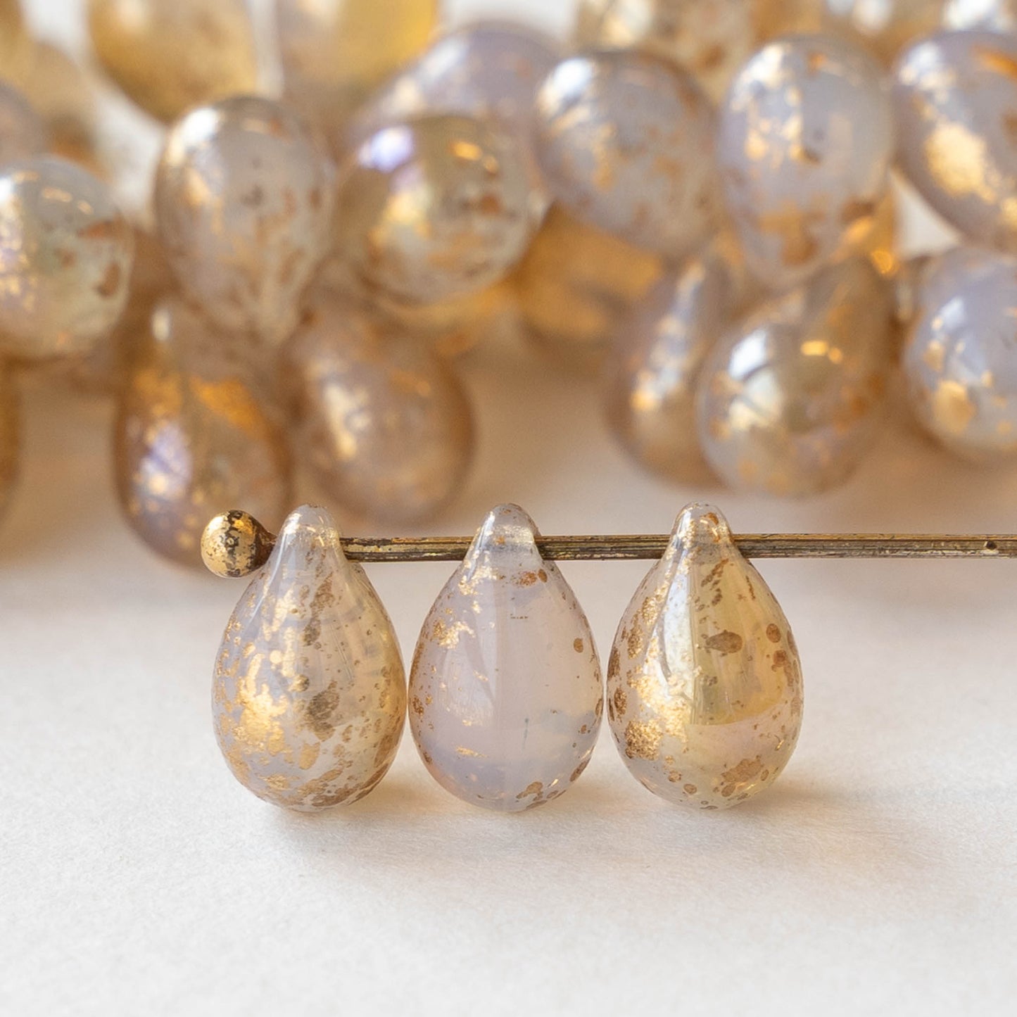 6x9mm Glass Teardrop - White Opaline with Gold Dust - 25 Beads