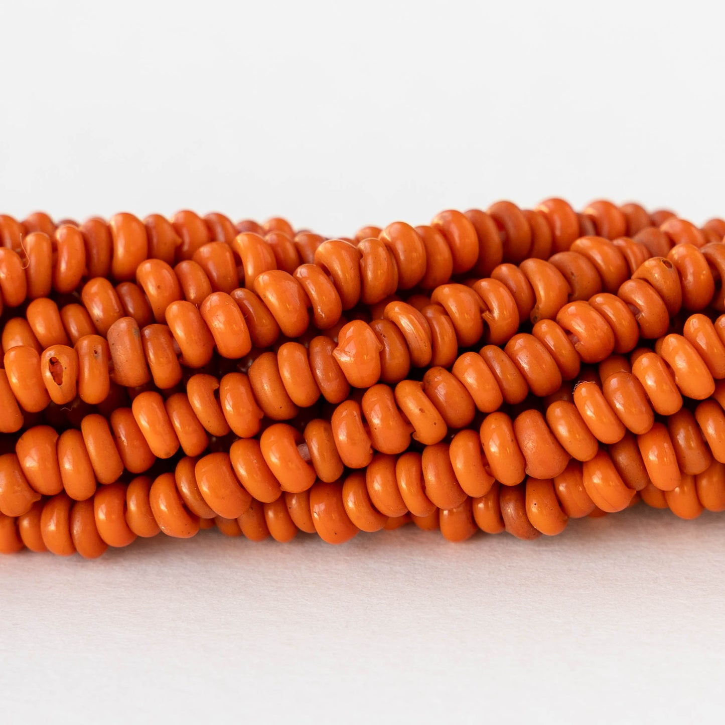 Rustic Indonesian Glass Ring Beads - Opaque Orange - Whole or Half Strand