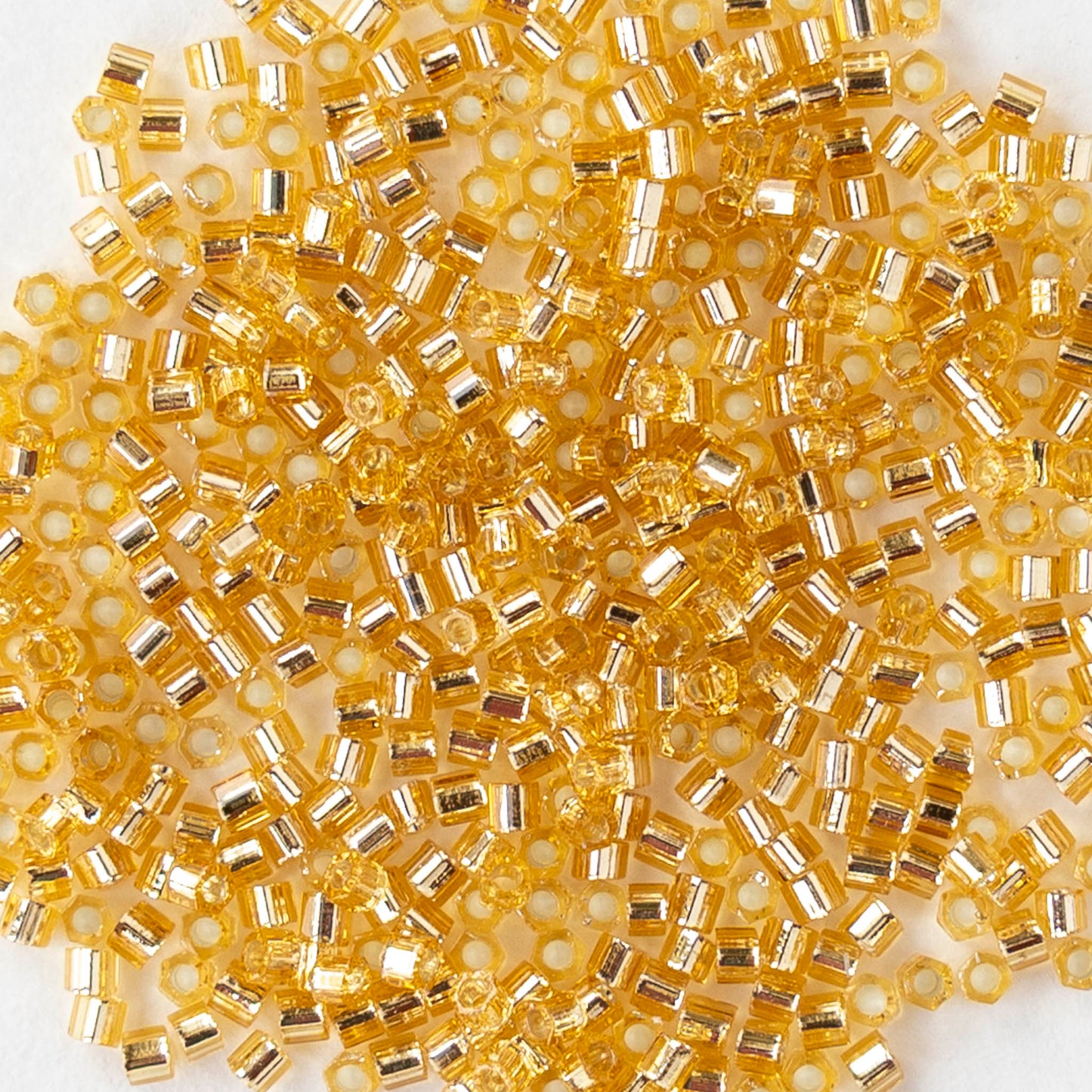 15/0 Glass Hex Cut Seed Beads - Silver Lined Topaz - 10 grams