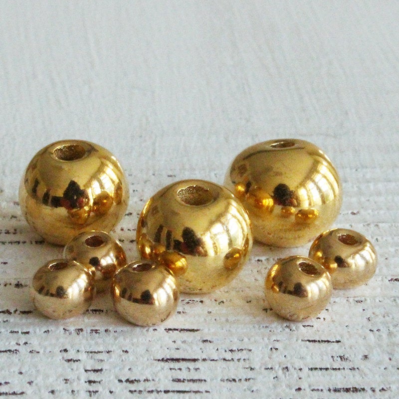6-7mm 24K Gold Coated Ceramic Round Beads - Gold