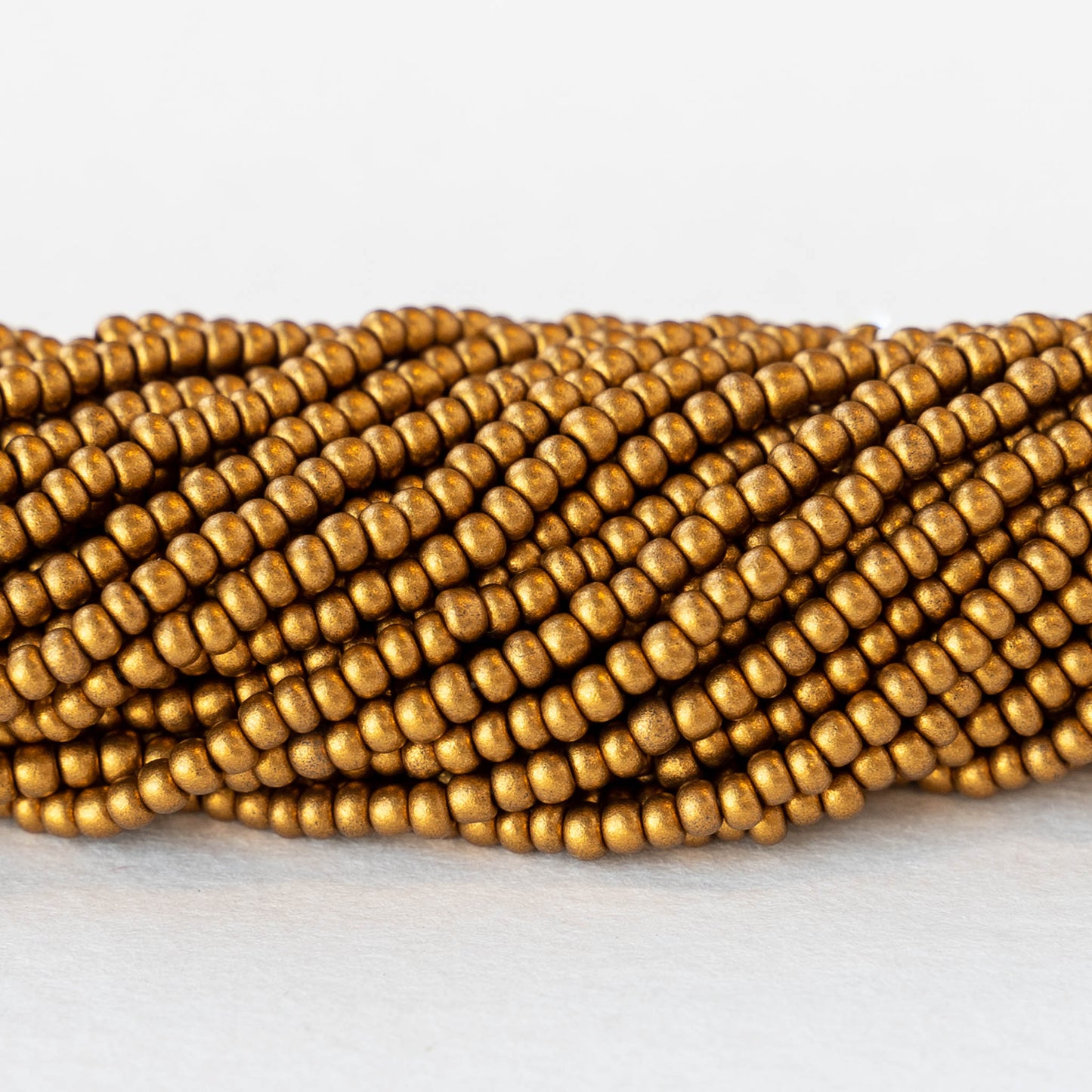 11/0 Glass Seed Beads - Antique Matte Gold - 6 Strands