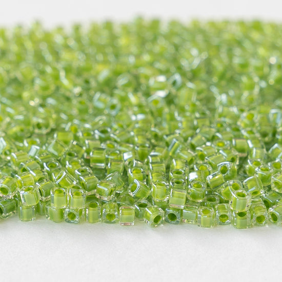 1.8mm Miyuki Cube Beads  - Color Lined Lime in Crystal - 20 grams