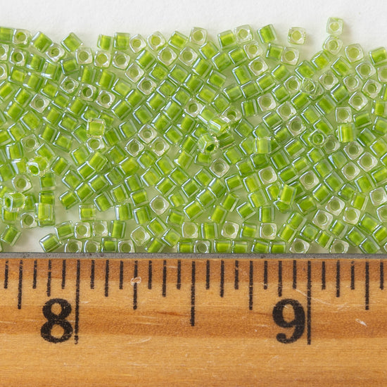 1.8mm Miyuki Cube Beads  - Color Lined Lime in Crystal - 20 grams