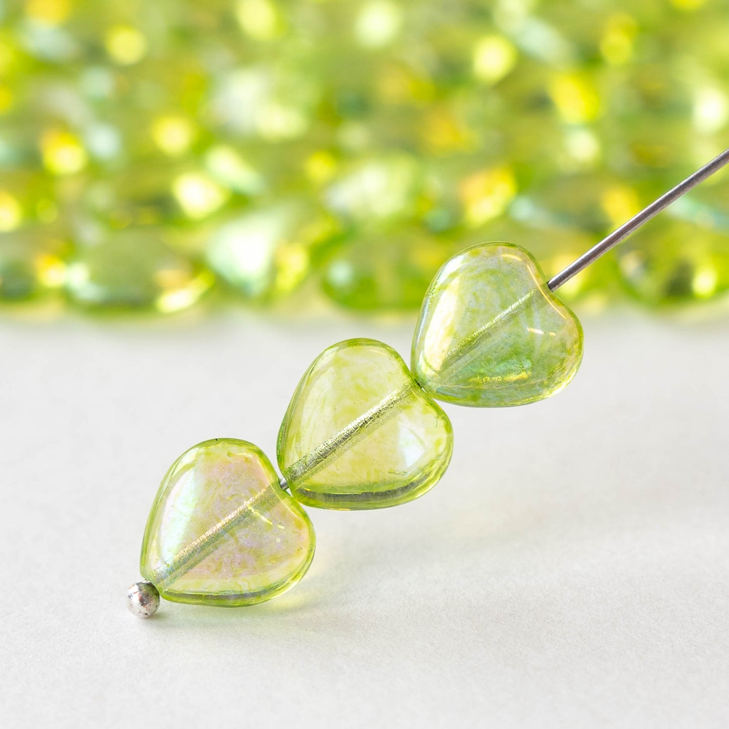 10mm Glass Heart Beads - Transparent Green Luster AB - 12 hearts