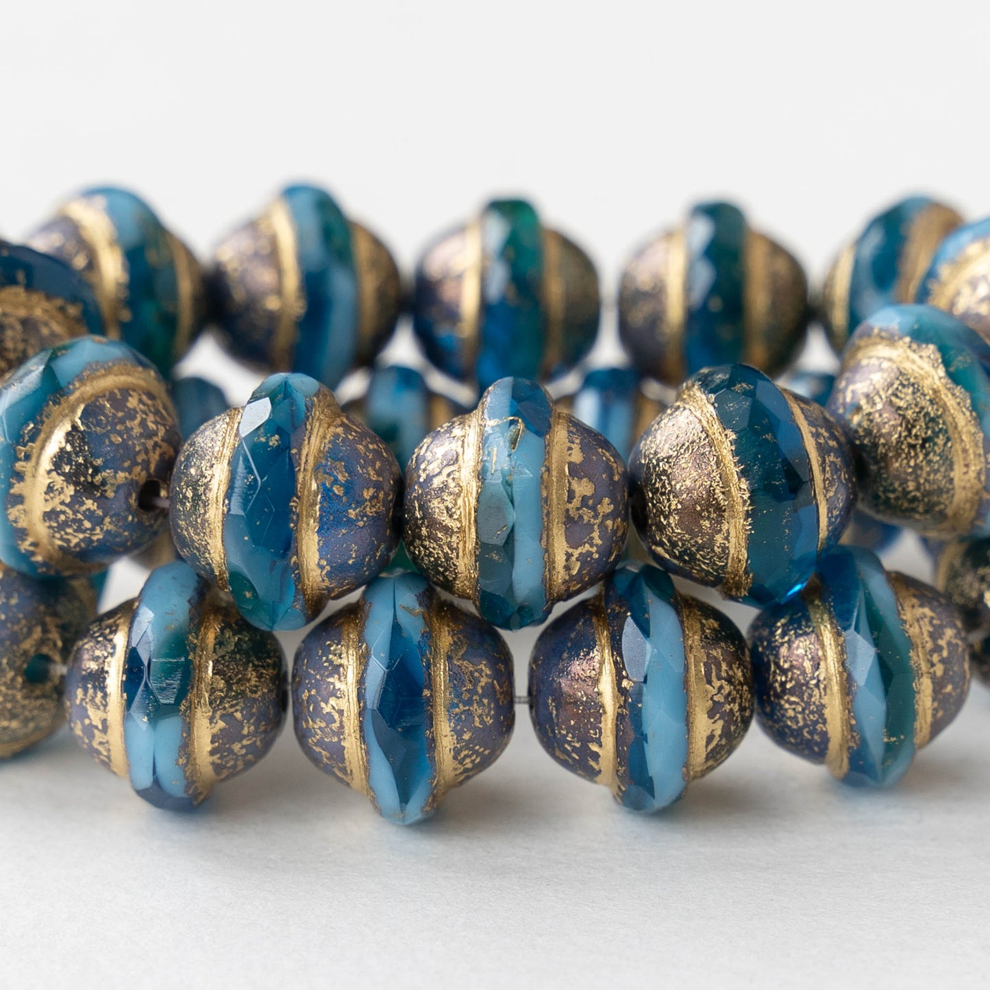 Load image into Gallery viewer, 10x12mm Saturn Beads - Teal and Sky Blue with Bronze and Gold Etched - 6 Beads
