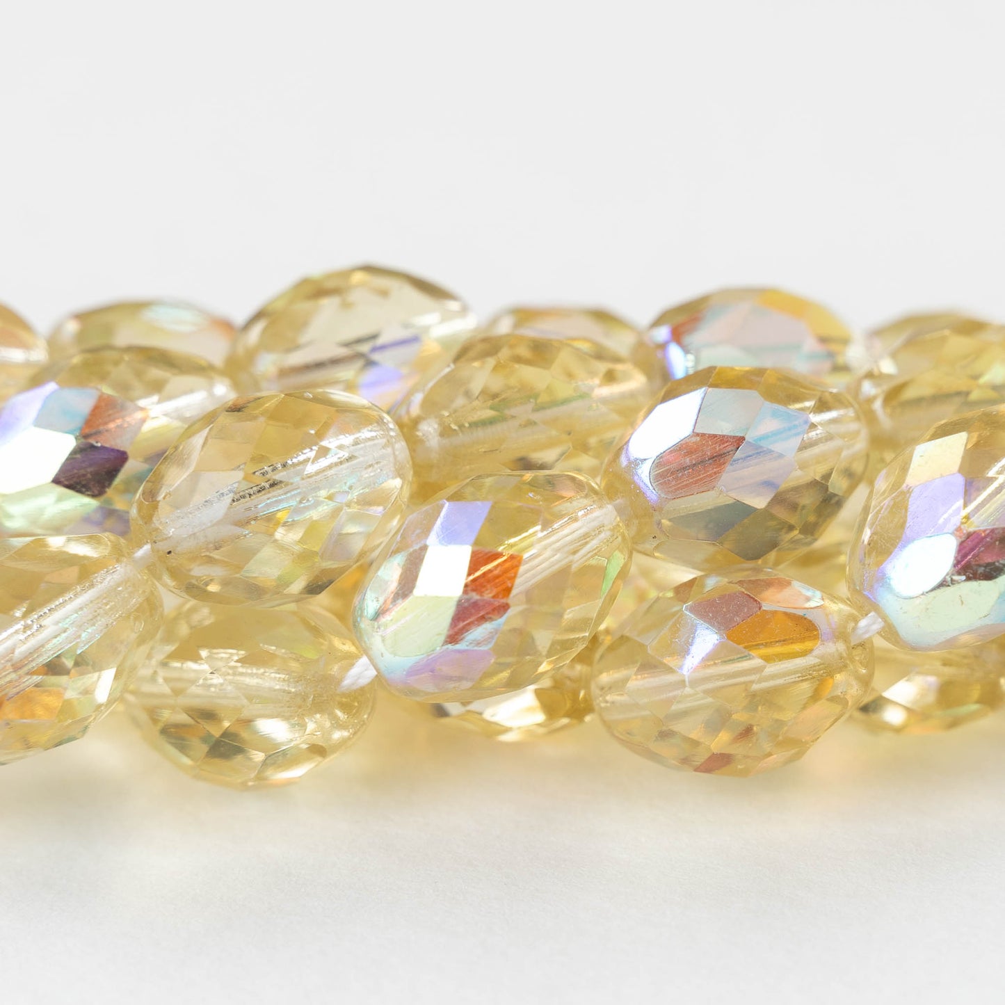 10x14mm Firepolished Glass Oval Beads - Pale Yellow AB - 4 beads