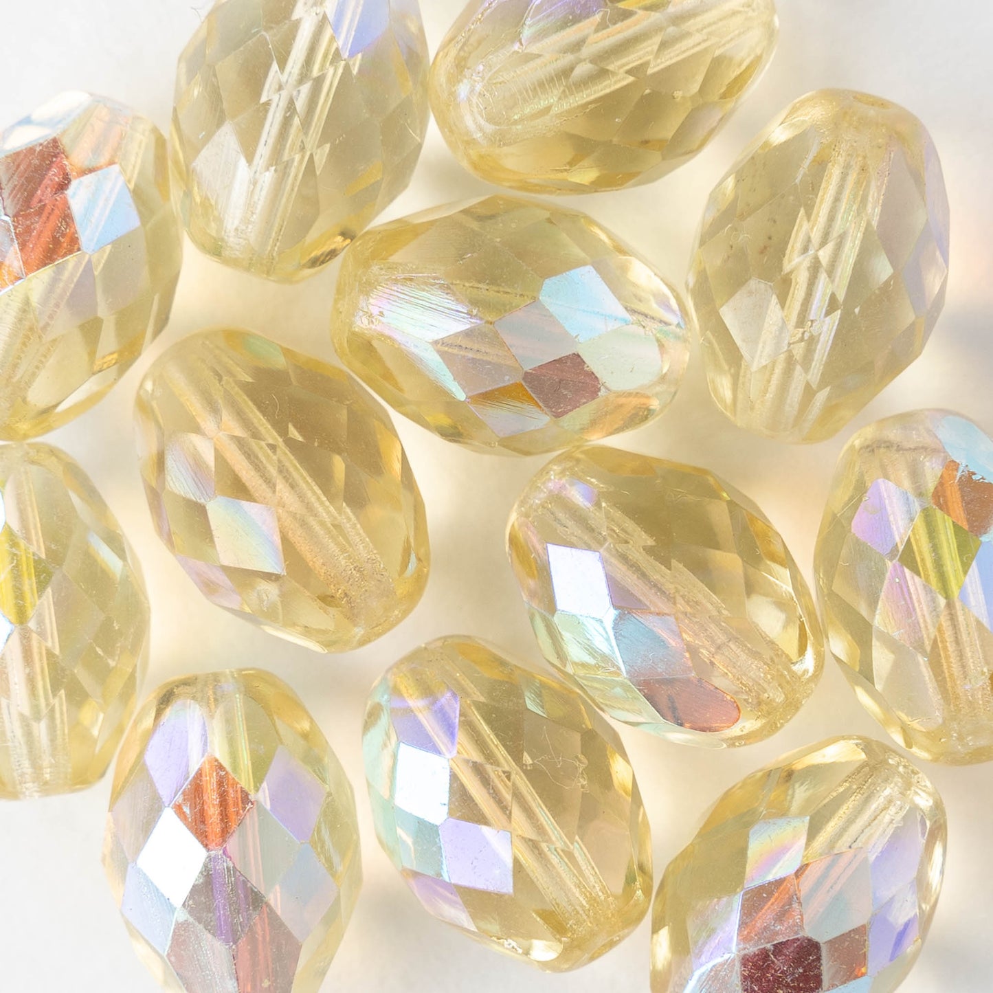 10x14mm Firepolished Glass Oval Beads - Pale Yellow AB - 4 beads