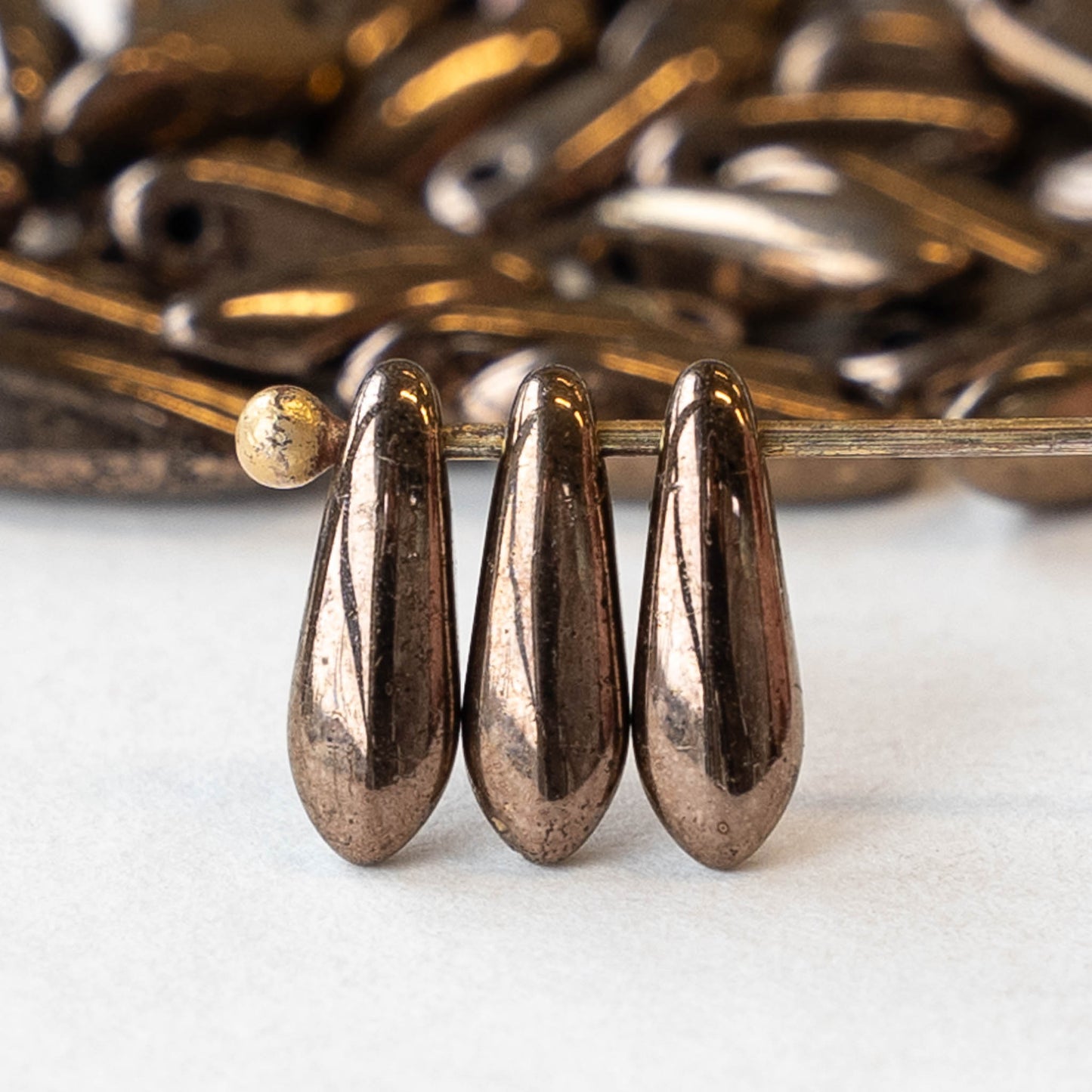 11mm Dagger Beads - Metallic Bronze - 100 beads