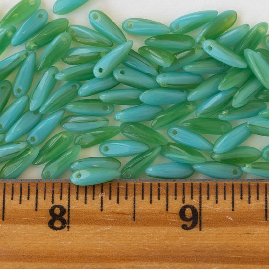 Load image into Gallery viewer, 11mm Dagger Beads - Green Blue Mixed Glass - 120 beads
