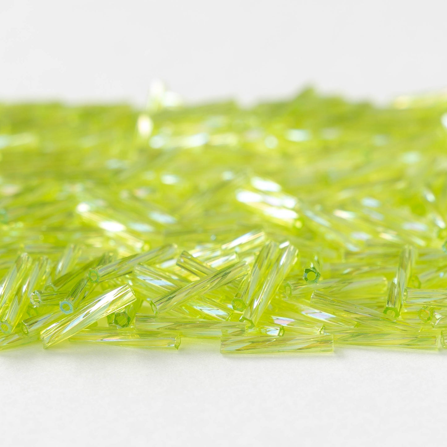 12mm Twisted Bugle Bead - Light Green AB - 10 or 20 grams