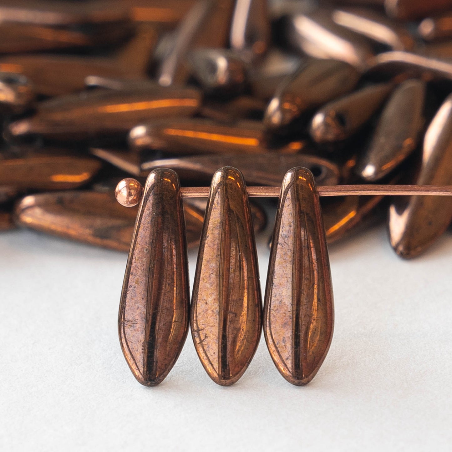 16mm Dagger Beads - Metallic Bronze - 100 beads