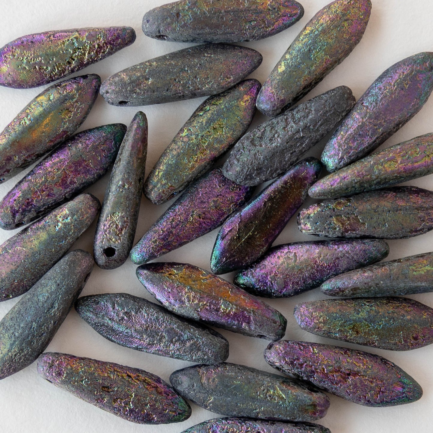 Iridescent beads on a white background