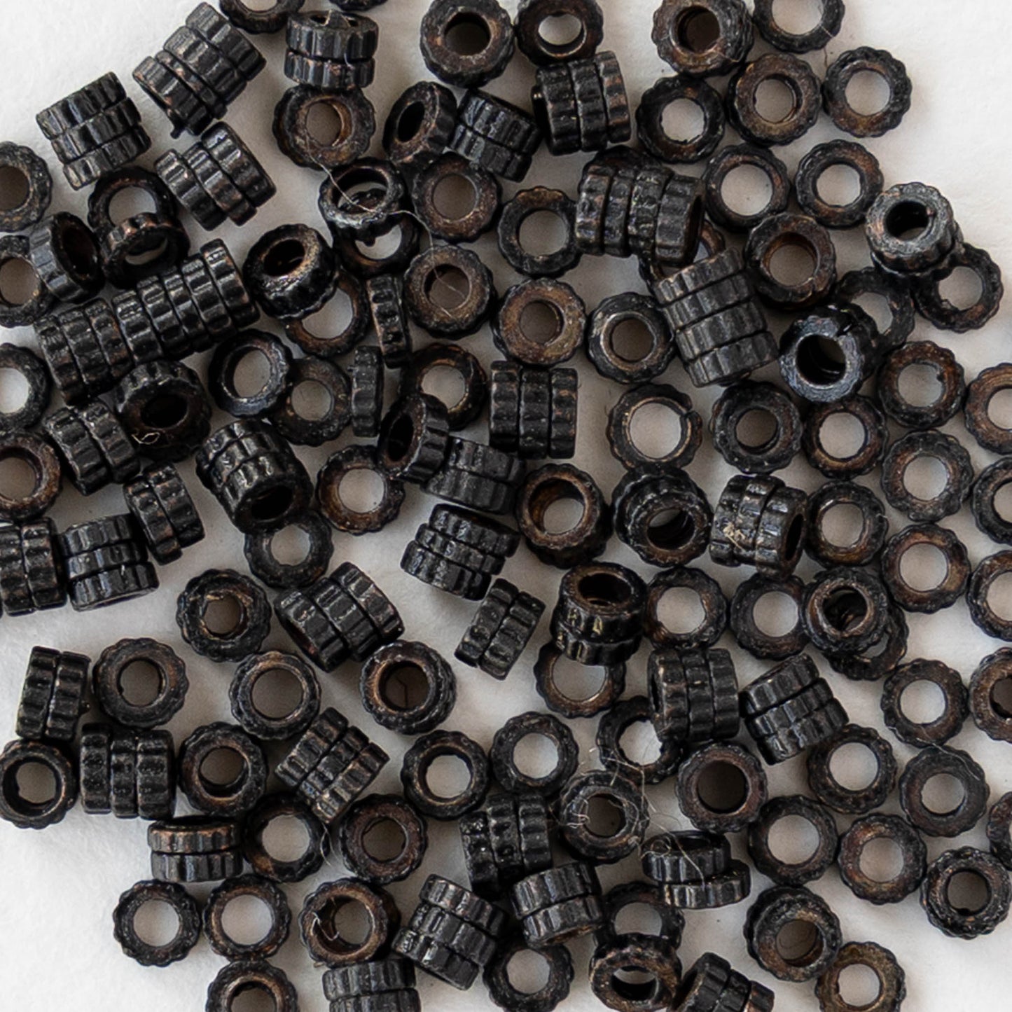 2.5mm Cog Spacer Beads - Black Brass - 3 Inches ` 100 Beads