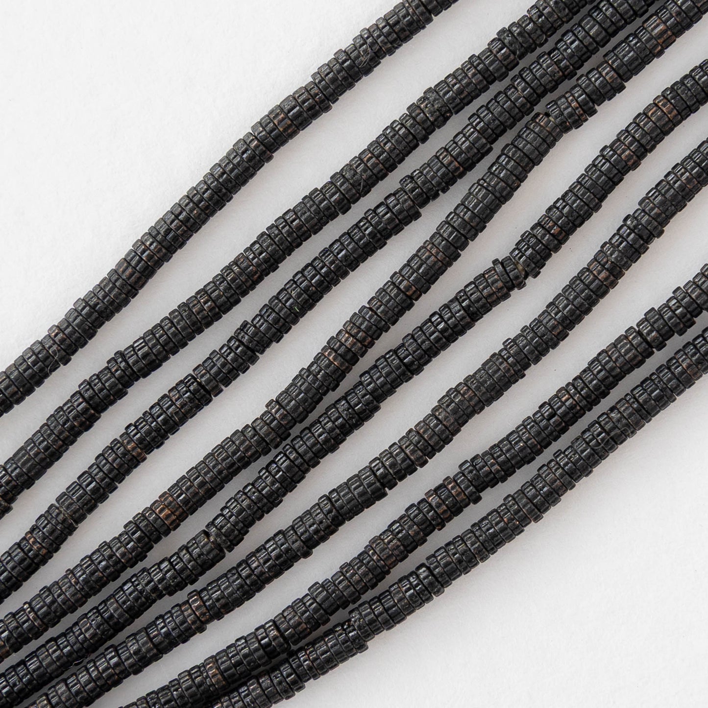 2.5mm Cog Spacer Beads - Black Brass - 3 Inches ` 100 Beads