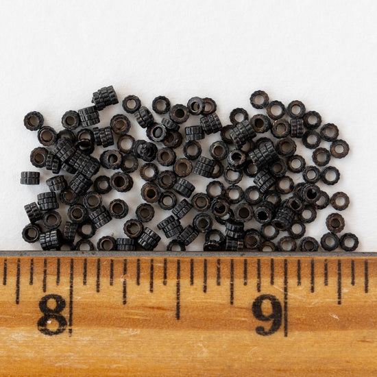 2.5mm Cog Spacer Beads - Black Brass - 3 Inches ` 100 Beads
