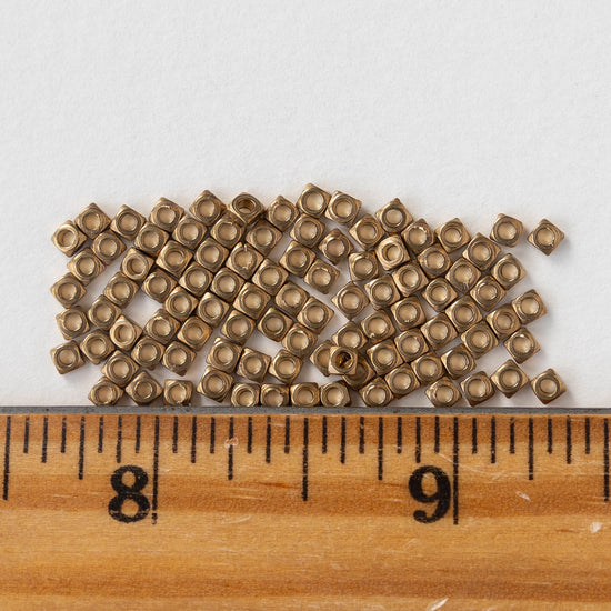 2.5mm Antique Brass Square Disk Beads - 100