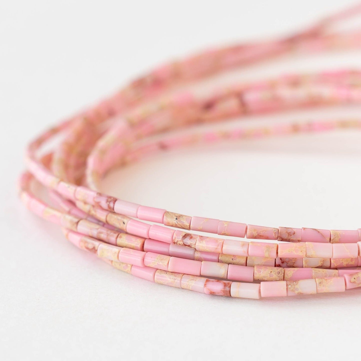 2.5x4mm Synthetic Impression Jasper Tiny Tube Beads - Pink - 15 inch strand ~85 beads