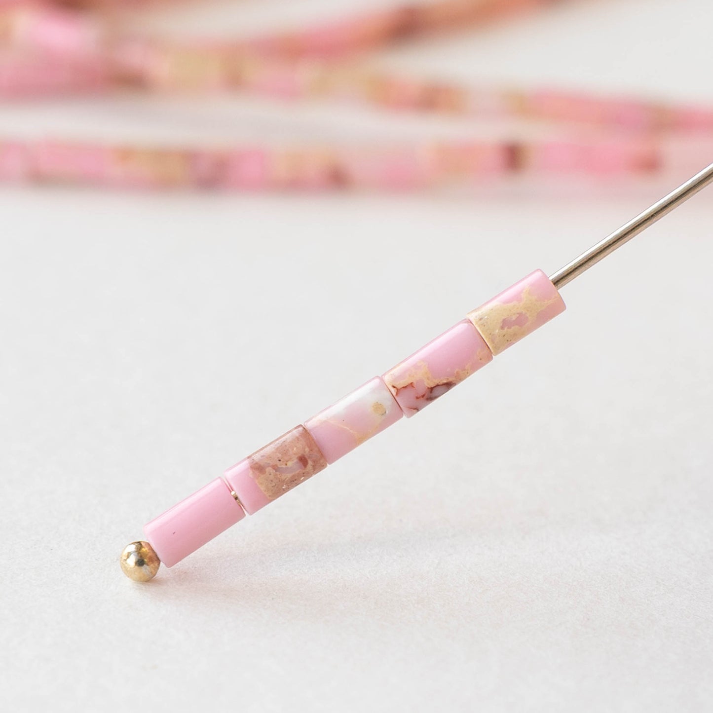 2.5x4mm Synthetic Impression Jasper Tiny Tube Beads - Pink - 15 inch strand ~85 beads