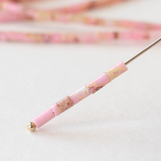 2.5x4mm Synthetic Impression Jasper Tiny Tube Beads - Pink - 15 inch strand ~85 beads