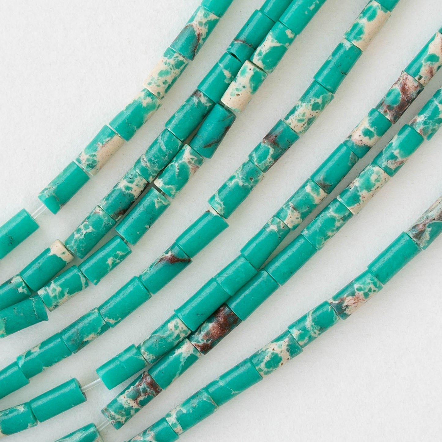 2.5x4mm Synthetic Impression Jasper Bugle Beads - Turquoise - 15 inch strand ~85 beads