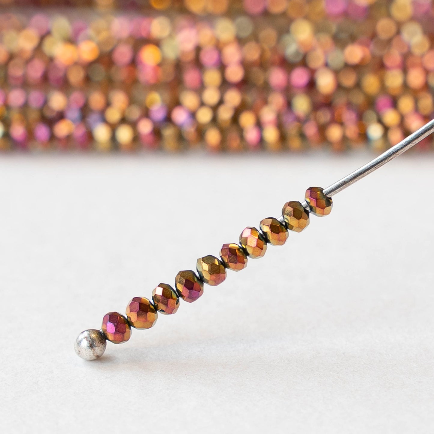 2mm Firepolished Rondelle Beads - Gold Pink Iris - 15 inch strand ~200 beads