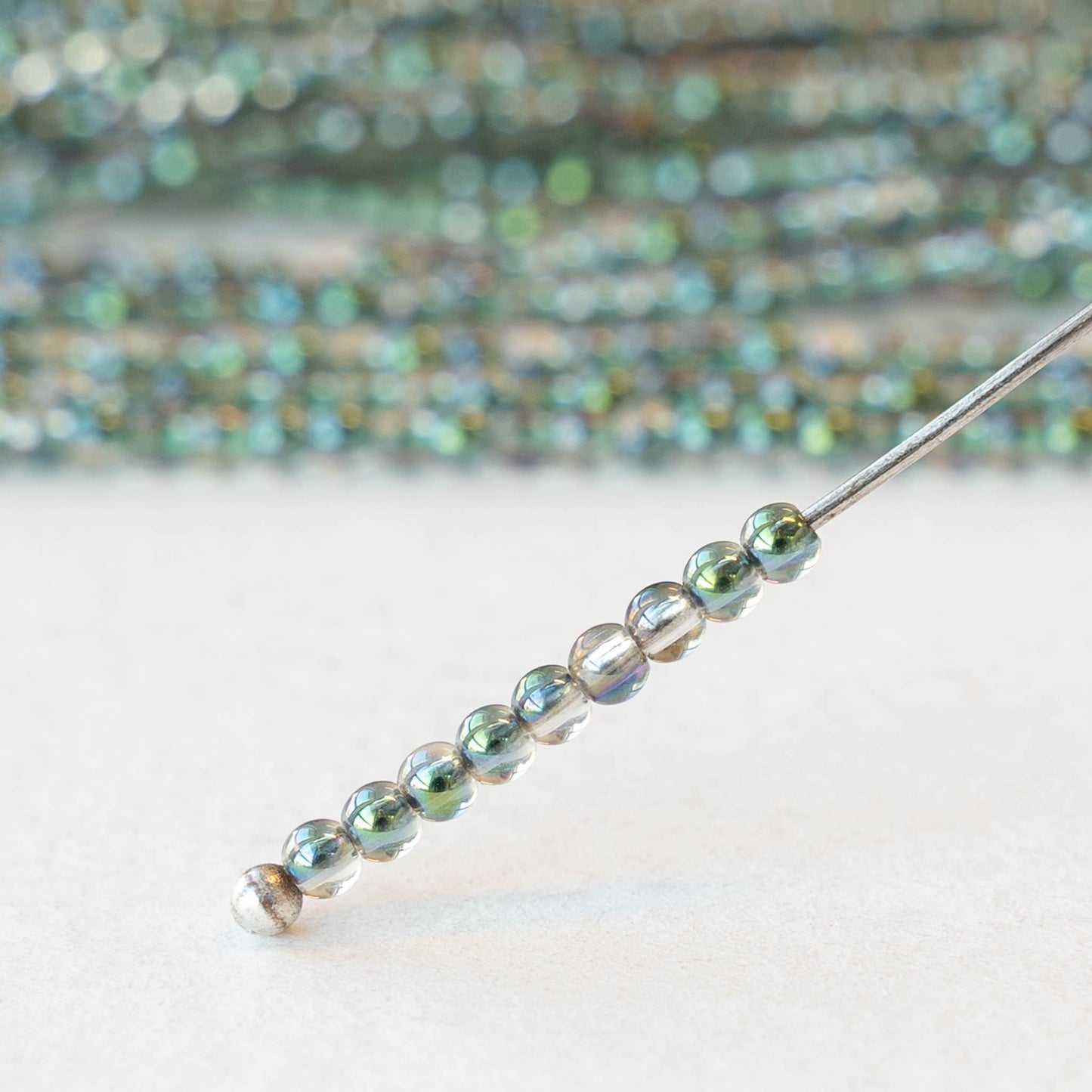 2mm Round Glass Beads - Crystal Green AB - 15 inch strand ~200 beads