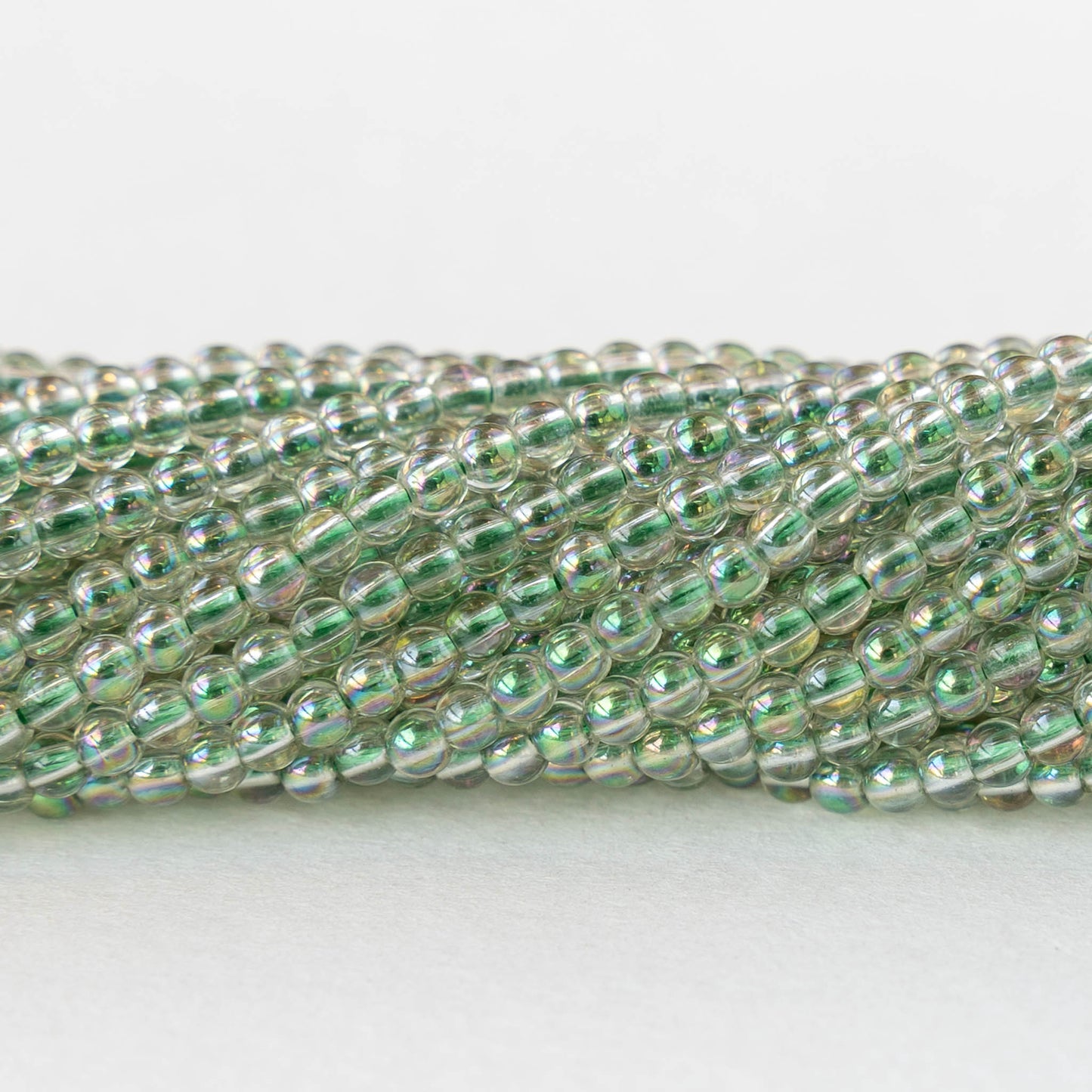 2mm Round Glass Beads - Crystal Green Luster - 15 inch strand ~200 beads