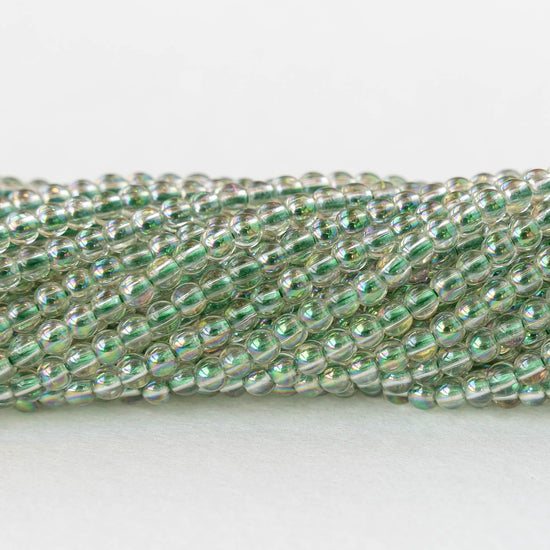 2mm Round Glass Beads - Crystal Green Luster - 15 inch strand ~200 beads