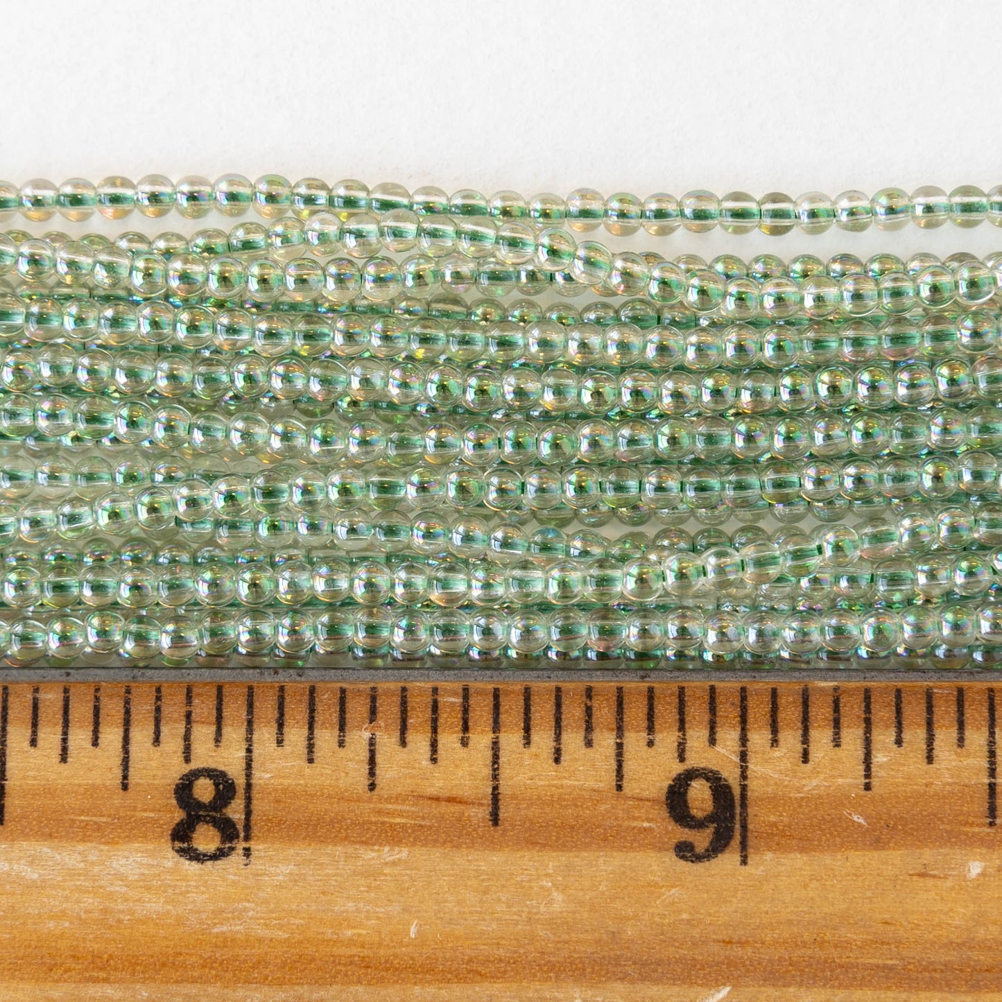 2mm Round Glass Beads - Crystal Green Luster - 15 inch strand ~200 beads