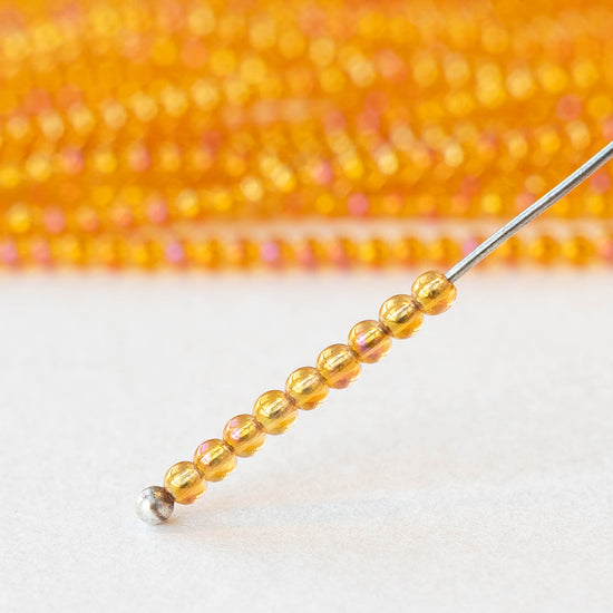 2mm Round Glass Beads - Orange AB - 15 inch strand ~200 beads