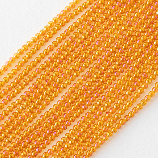 2mm Round Glass Beads - Orange AB - 15 inch strand ~200 beads