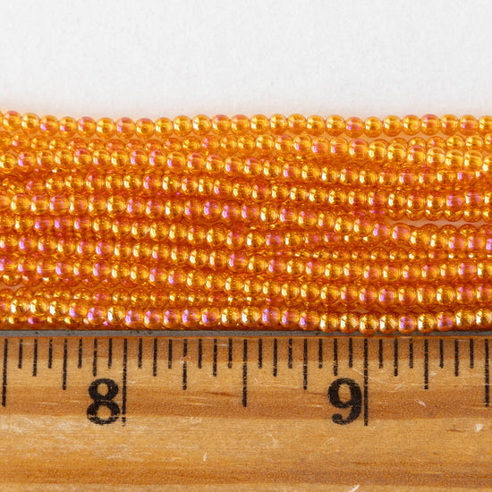 2mm Round Glass Beads - Orange AB - 15 inch strand ~200 beads