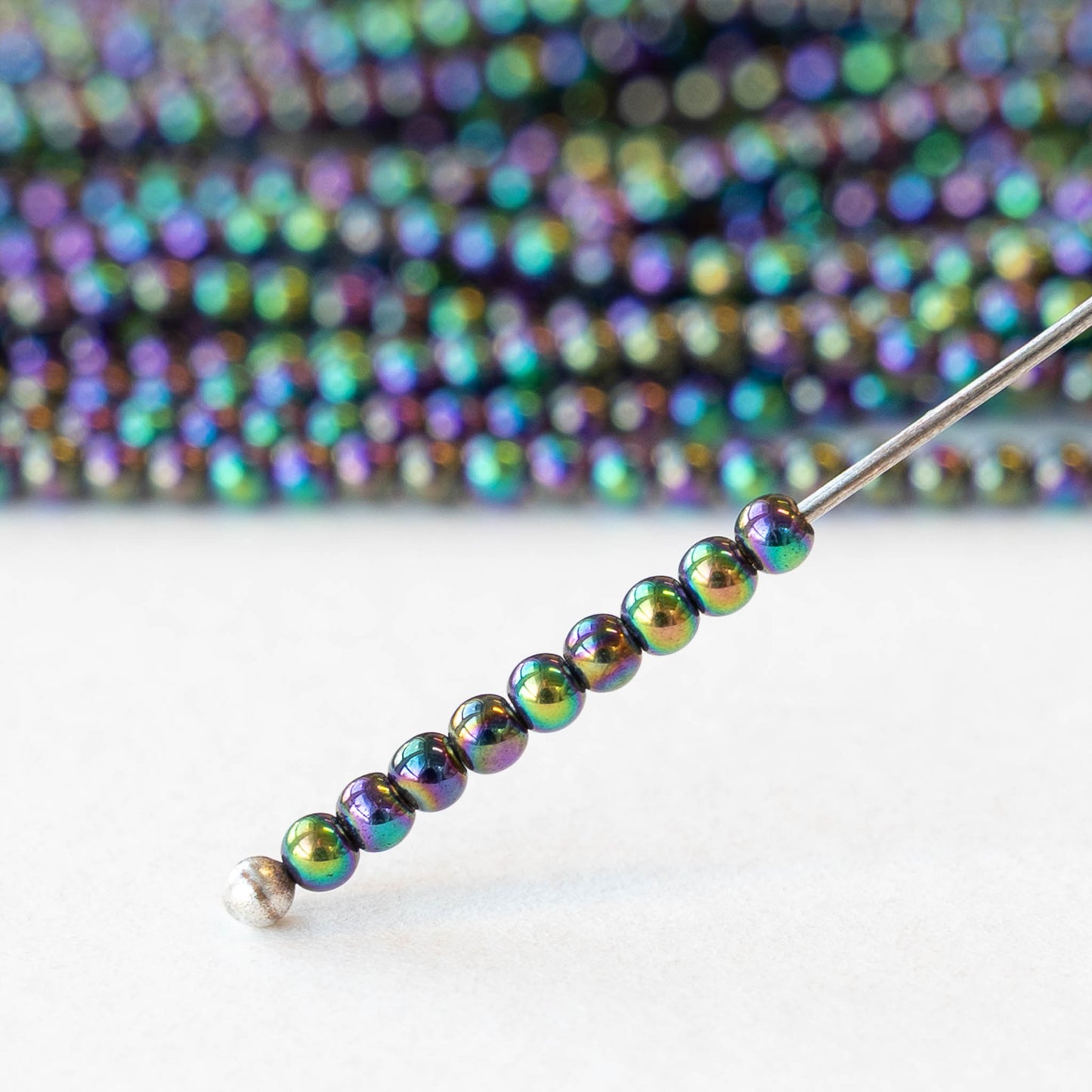 2mm Round Glass Beads - Purple Green Iris - 15 inch strand ~200 beads