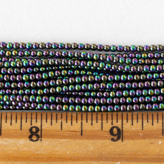 2mm Round Glass Beads - Purple Green Iris - 15 inch strand ~200 beads