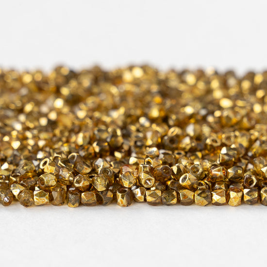 2mm Round Firepolished Beads - Crystal Apricot Metallic - 50 beads