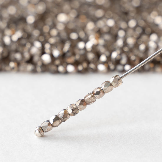 2mm Round Firepolished Beads - Crystal Smoky Metallic - 50 beads