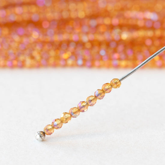 2mm Round Firepolished Beads - Orange AB - 15 inch strand ~200 beads
