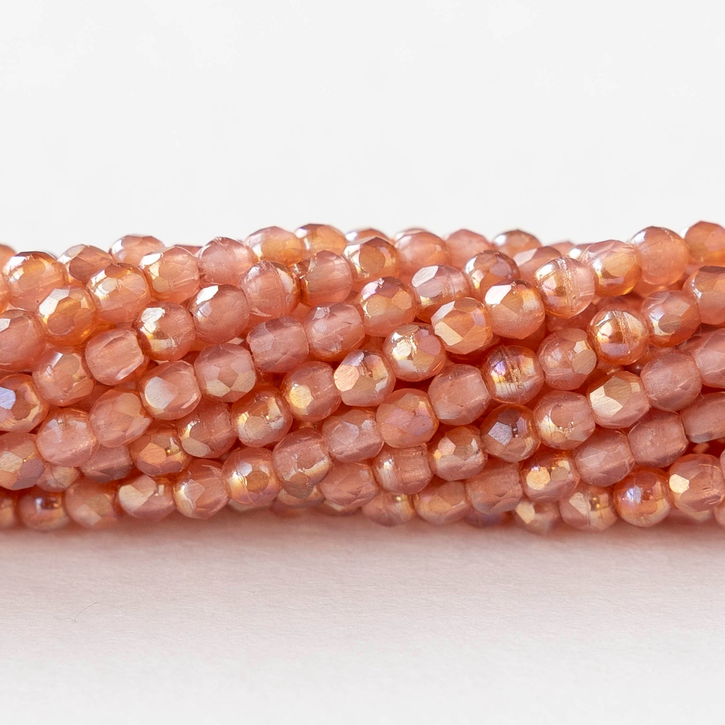 2mm Round Firepolished Beads - Milky Pink Celsian - 50 beads
