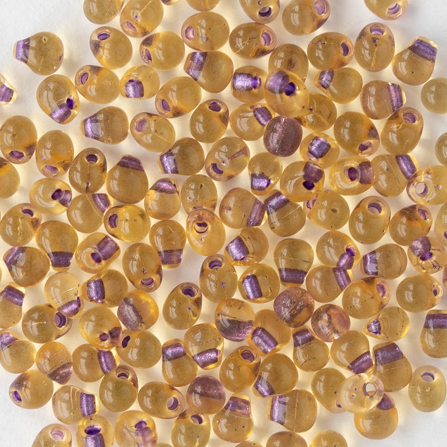 3.4mm Glass Magatama Teardrop Beads - Purple Lined Amber - 10 or 20 grams