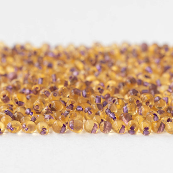 3.4mm Glass Magatama Teardrop Beads - Purple Lined Amber - 10 or 20 grams