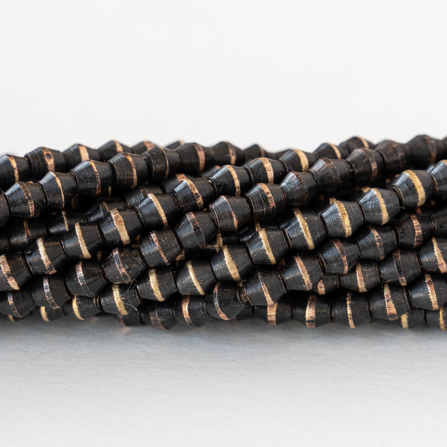 3.5mm Brass Bicone Beads - Black - 6 inch strand ~42 beads