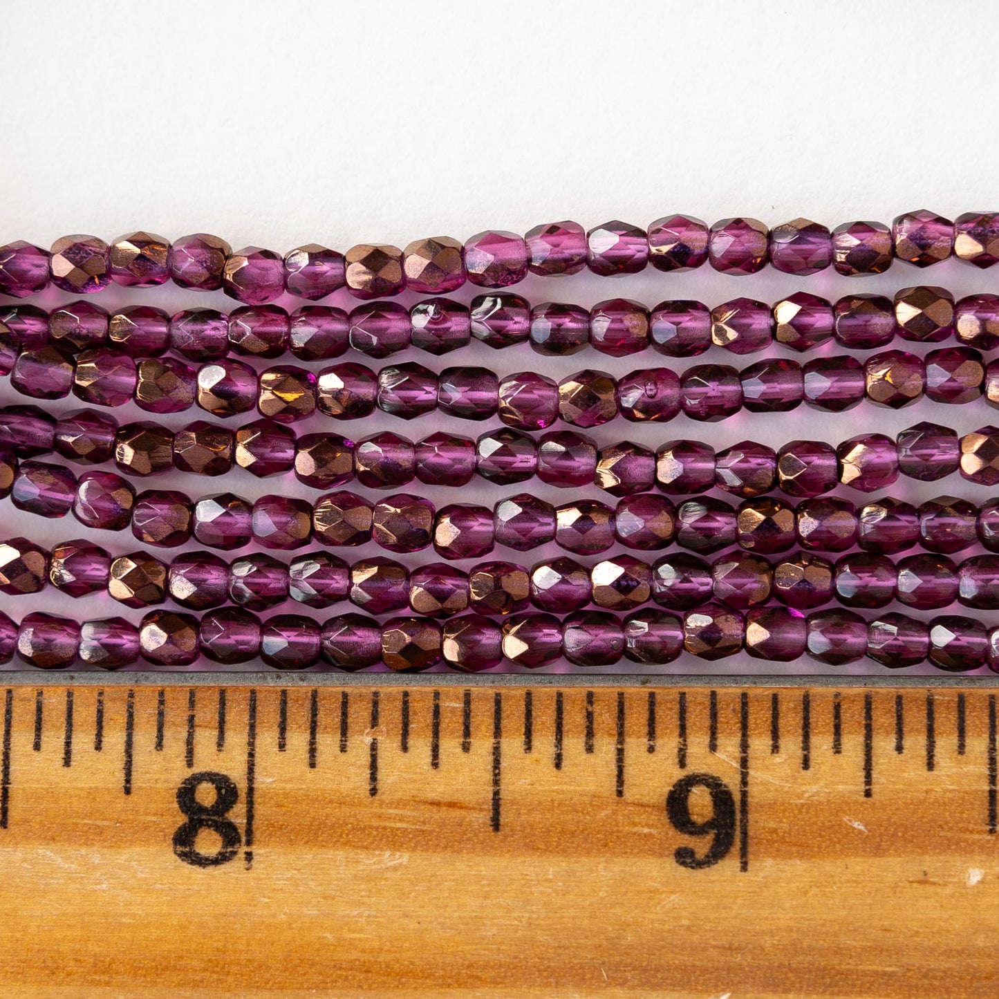 3mm Round Faceted Glass Beads - Transparent Raspberry Bronze - 50 Beads