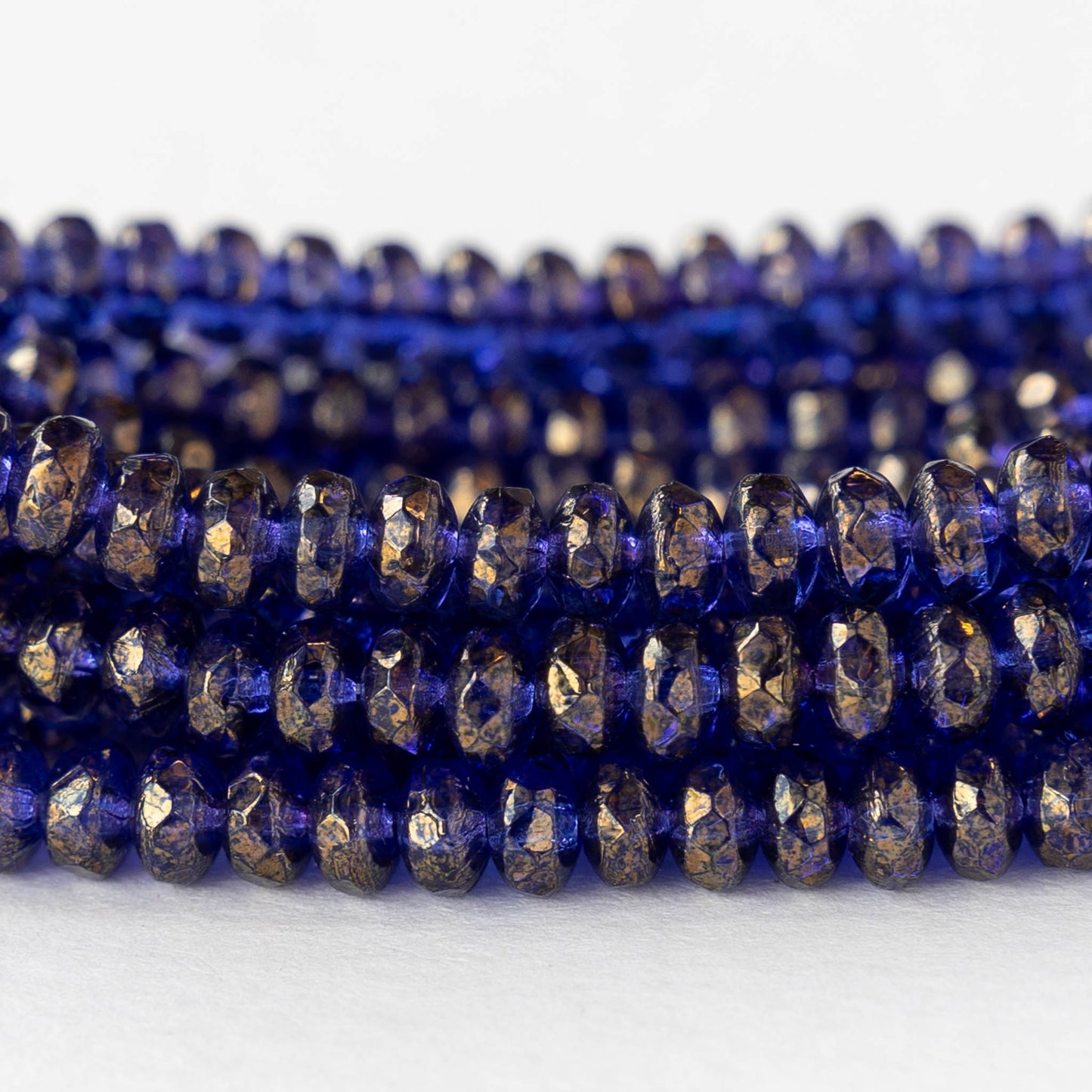 4mm Faceted Glass Rondelle Beads - Transparent Cobalt with a Gold  Finish- 50 beads