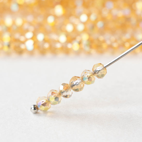 3x4mm Faceted Rondelle Beads - Light Orange AB - 13 inch strand ~110 beads