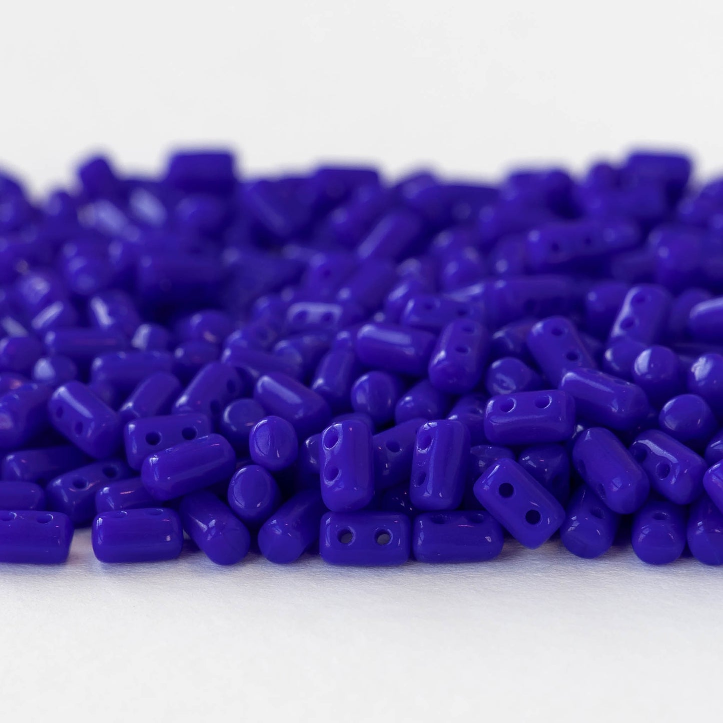 3x5mm Glass Rulla Beads - Opaque Cobalt Blue - 10 grams