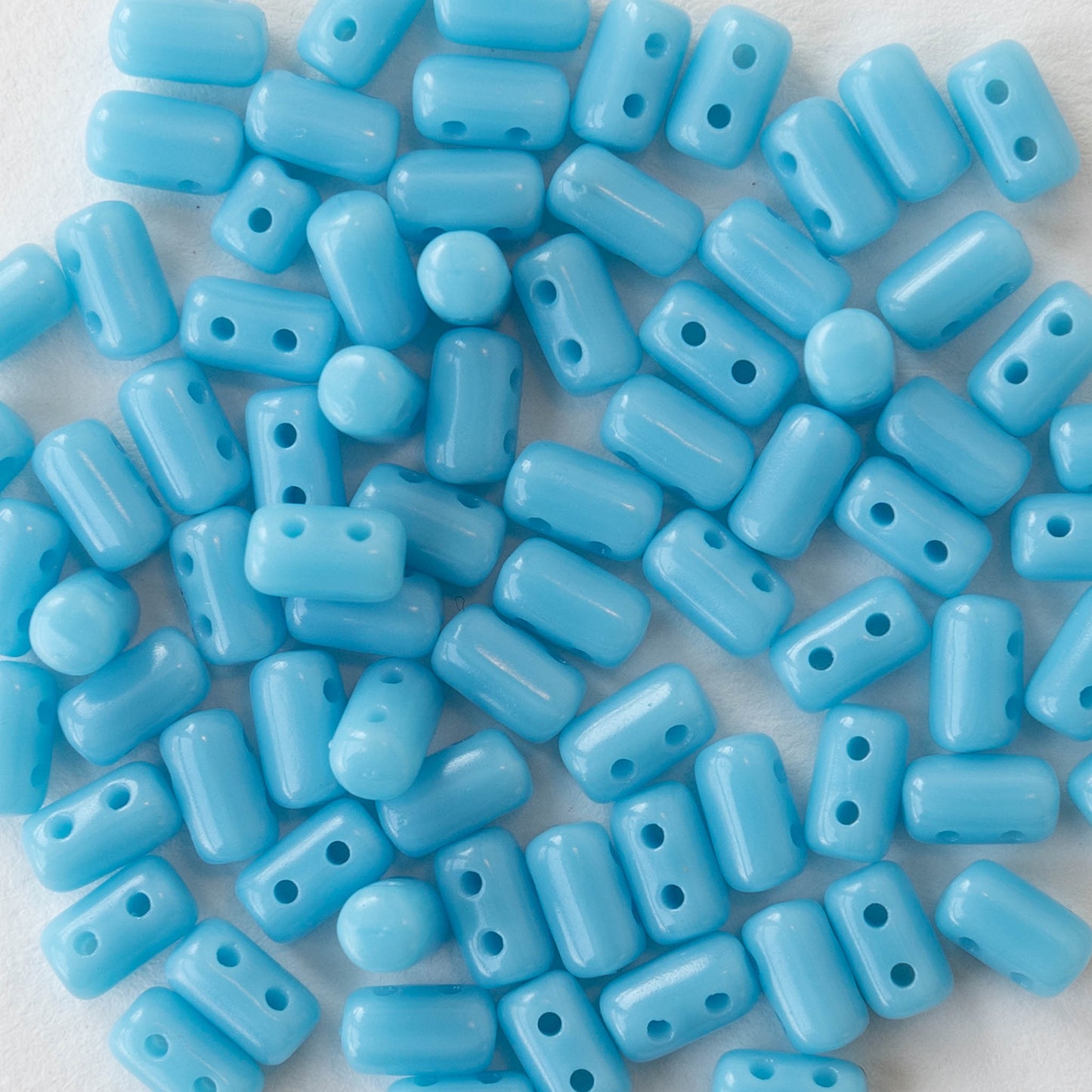 3x5mm Glass Two Hole Rulla Beads - Opaque Light Blue - 10 grams