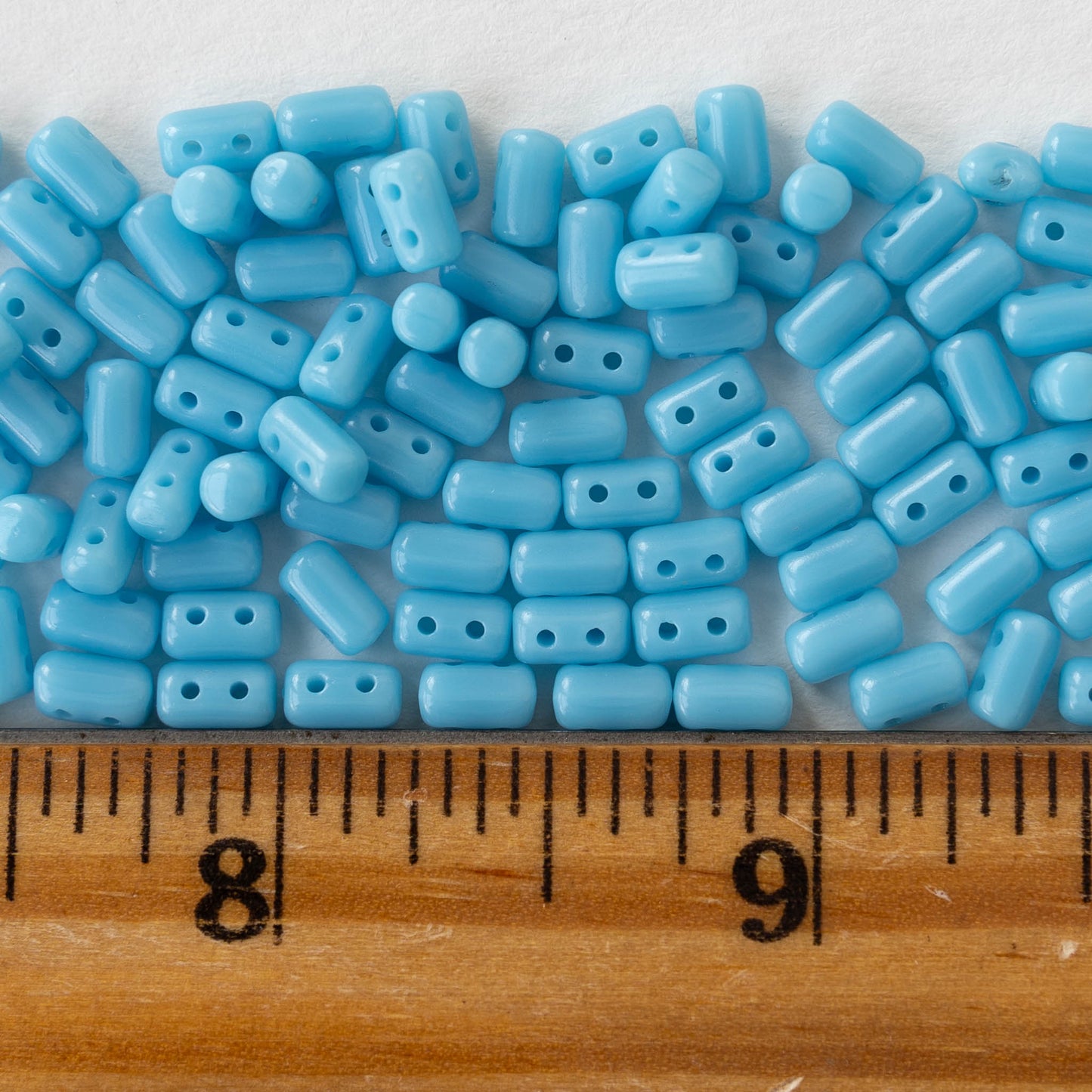 3x5mm Glass Two Hole Rulla Beads - Opaque Light Blue - 10 grams