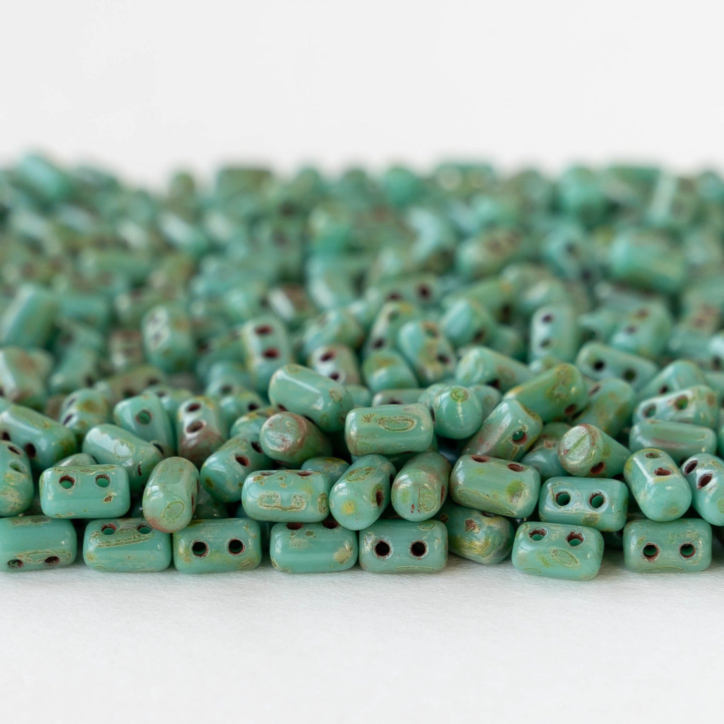 3x5mm Two Hole Rulla Beads - Opaque Turquoise Picasso - 10 grams